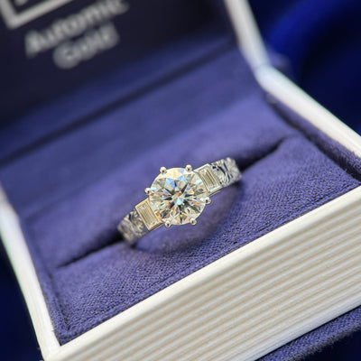 front view of 950 Platinum and Prongs-low-set 1.5ct Round Lab Diamond & Bezel-set 2pc Baguette Lab Diamonds on Roses with Holly Leaves Engraved on 2.5mm width Band Custom Ring, size 4.75