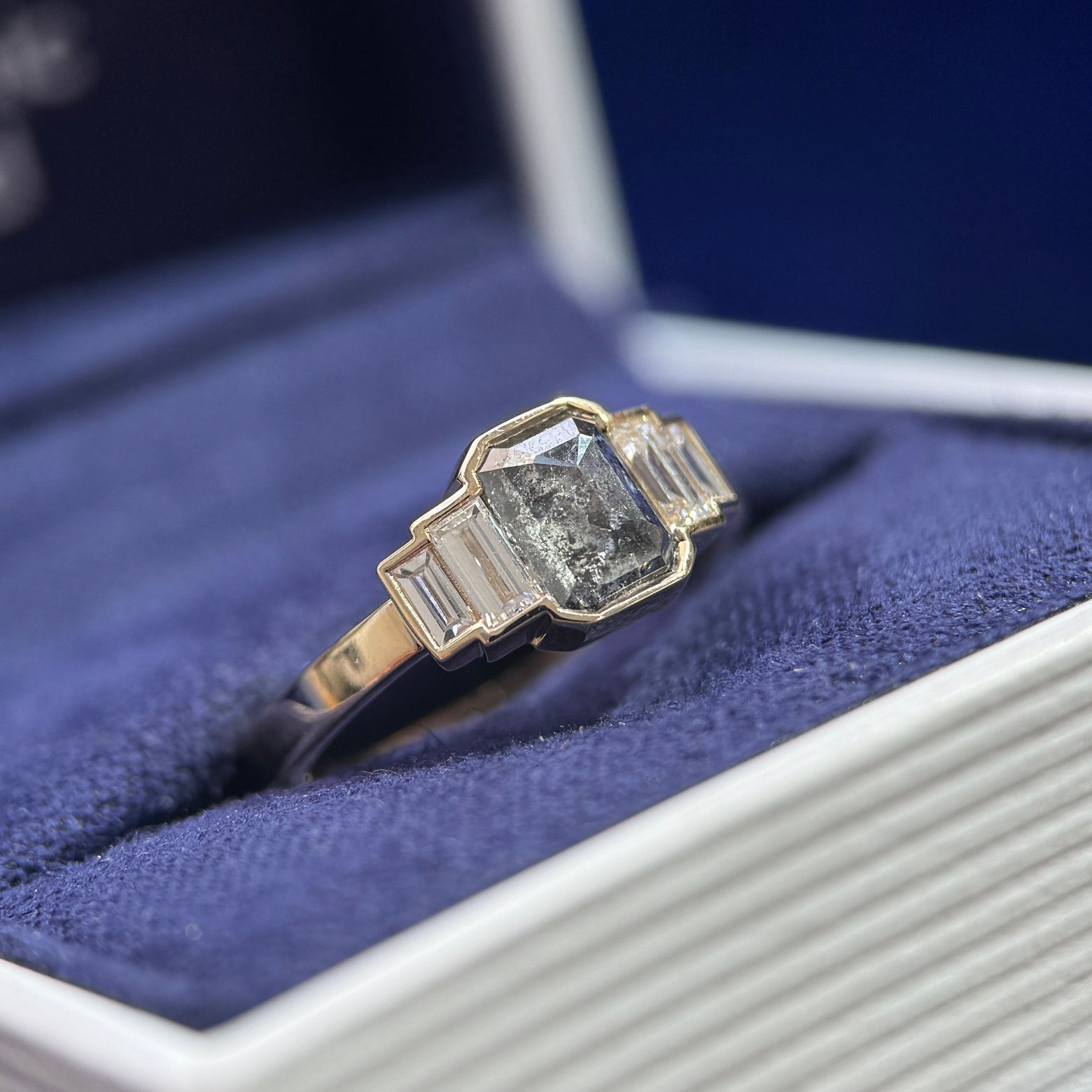 side view of 14k Yellow Gold and 1ct Salt-and-pepper Emerald-cut Diamond with 4pc Baguette Lab Diamonds on 2mm Band Custom Ring, size 5.25