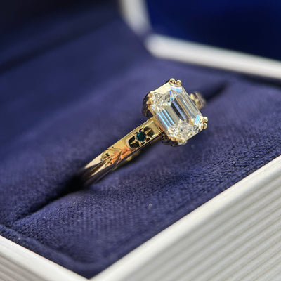 side view of 14k Yellow Gold and High-set 1ct Octagon Custom cut Lab Diamond with Blue and Green Round Small Diamonds on 2.5mm Etched Band Custom Ring, size 5.5