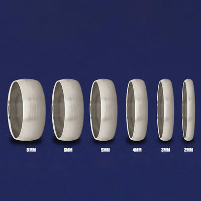 Seven versions of the Silver Curvy Matte Band showing the different thickness options of the ring from 8mm to 2mm