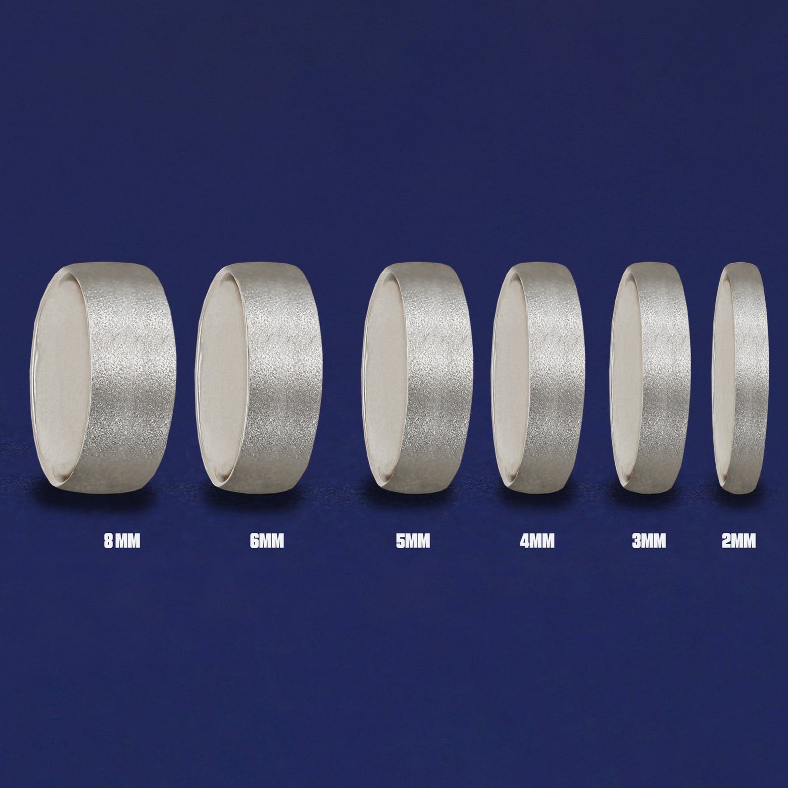Seven versions of the Silver Curvy Stardust Band showing the different thickness options of the ring from 8mm to 2mm