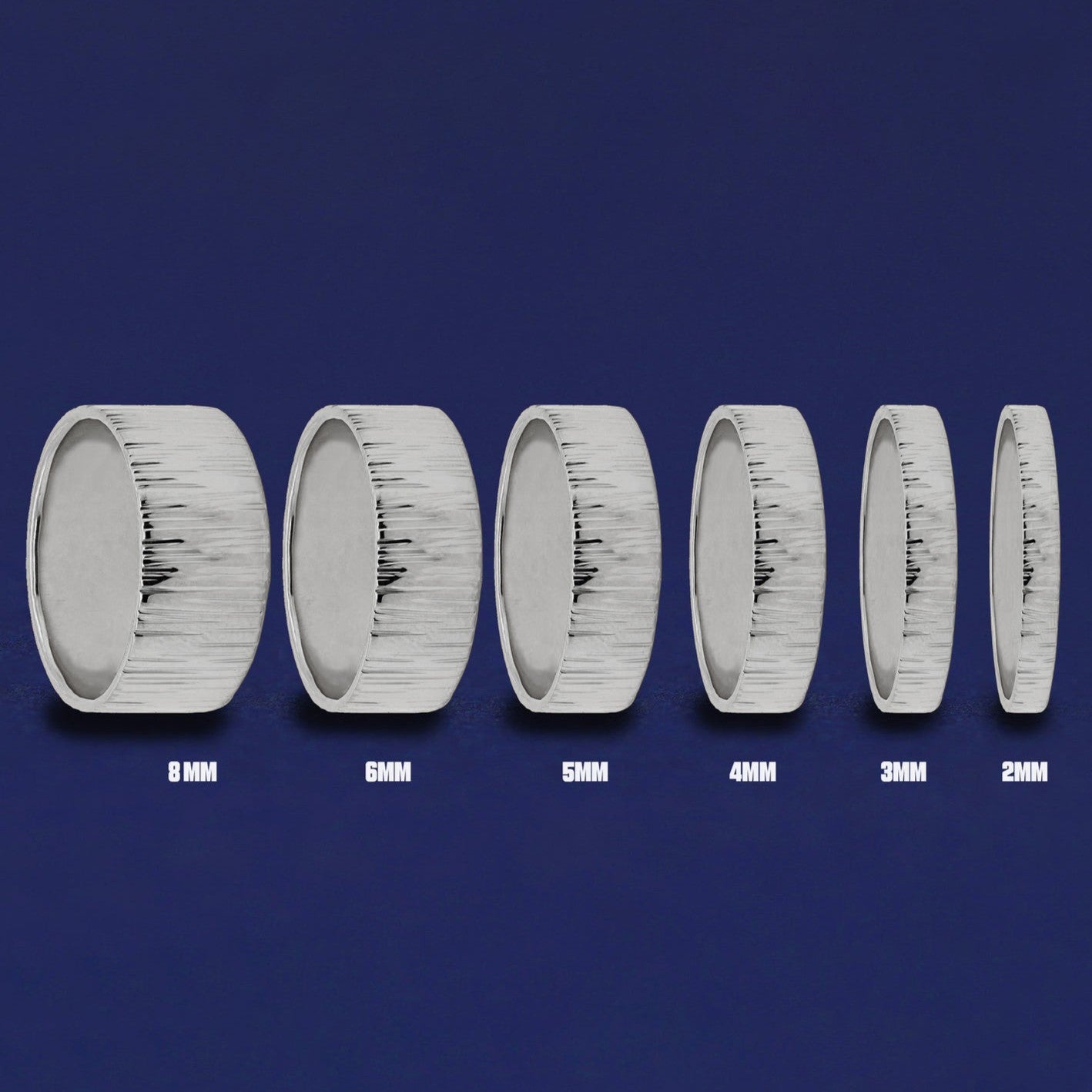 Seven versions of the Silver Industrial Wood Band showing the different thickness options of the ring from 8mm to 2mm