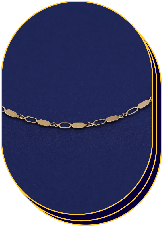 Close up view of a solid 14k yellow gold Tanlah Chain on a blue background