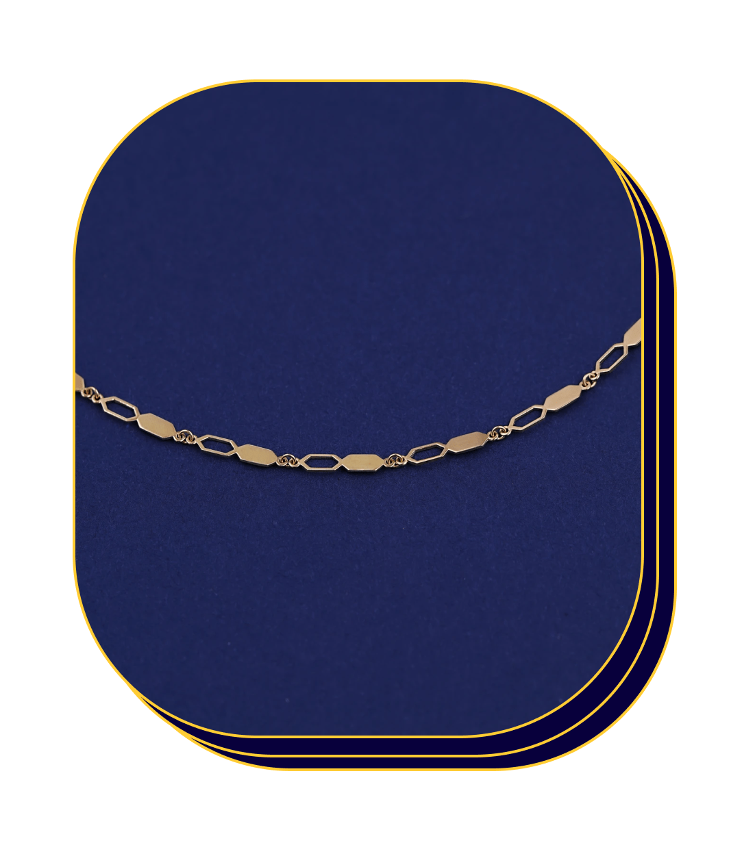 Close up view of a solid 14k yellow gold Tanlah Chain on a blue background