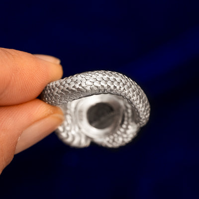 The underside view of a Engraved Black Diamond Silver Snake Ring to show the space under the diamond