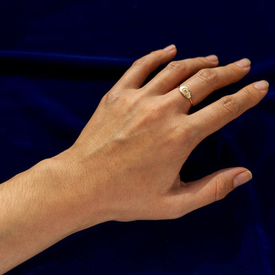 Full view of a Ruby Gemstone Evil Eye Ring on a model's finger