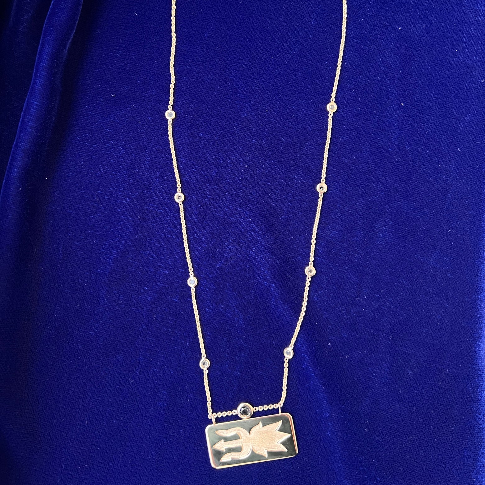 full view of necklace in with solid matching pendant