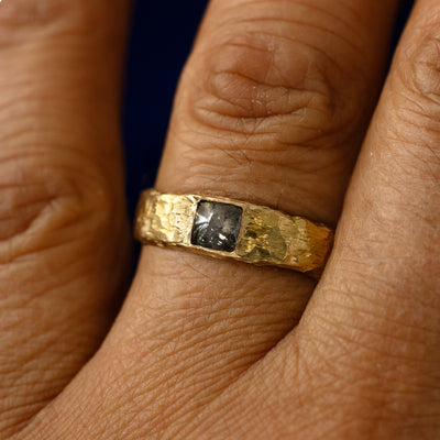 A square salt and pepper cabochon diamond organic band on a models finger