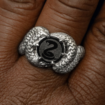 Close up view of a model's fingers wearing a gothic style 925 Sterling Silver Engraved Diamond Snake Ring