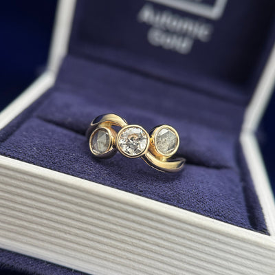 14k Yellow Gold and Bezel-set Clients Diamond with two 0.85ct Salt-and-pepper Diamonds Reset into Clients Band Custom Ring, size 5