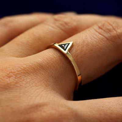 Side view of a solid 14 karat gold Triangle Diamond Ring on a model's finger