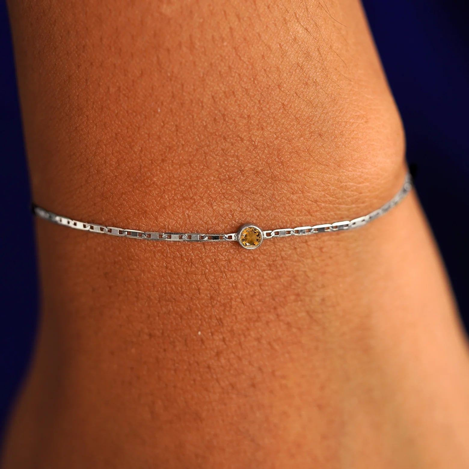 A model's wrist wearing a 14 karat white gold Citrine Bracelet