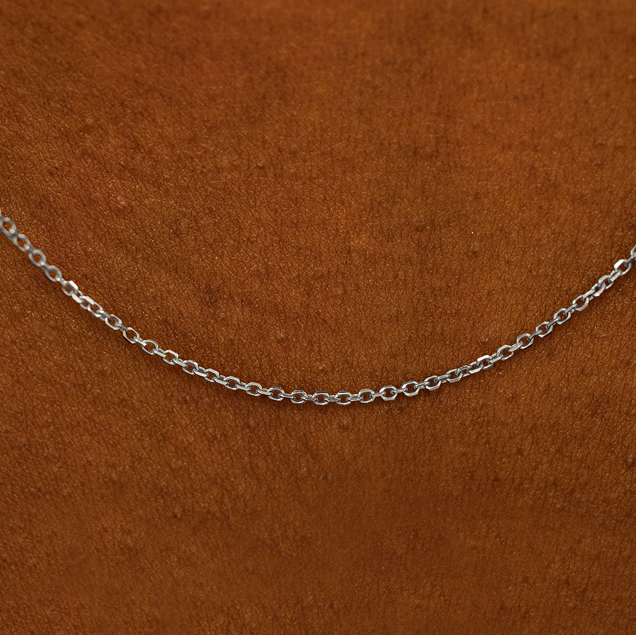 Close up view of cable chain on the model's neck