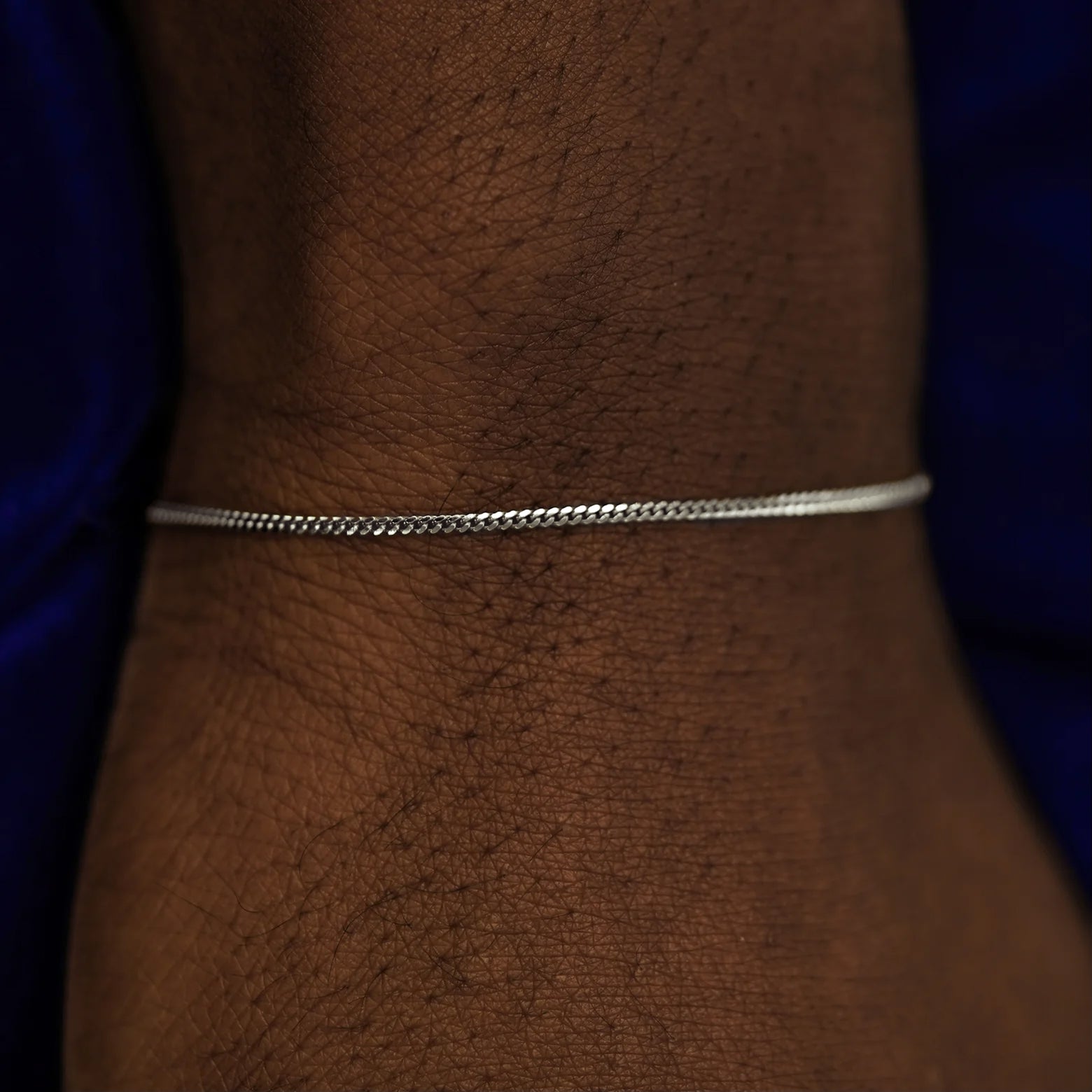 A model's wrist wearing a 14k white gold Mini Miami Bracelet