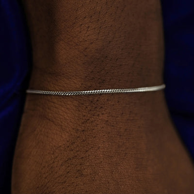 A model's wrist wearing a 14k white gold Mini Miami Bracelet