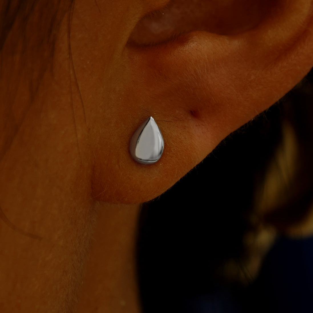 A model's ear wearing a 14k white gold Teardrop Earring