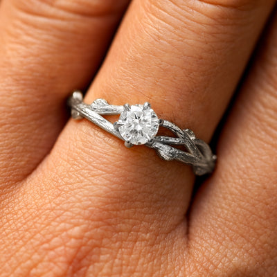 Close up view of a model's fingers wearing a 14k white gold lab diamond Branches Ring