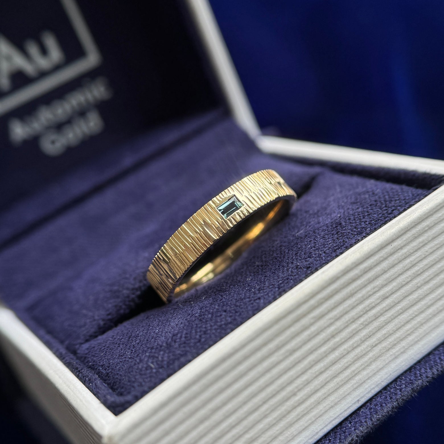 14k Yellow Gold and Flush-horizontal-set 3x2mm Teal Baguette on 4mm Wood Band Custom Ring, size 6.75