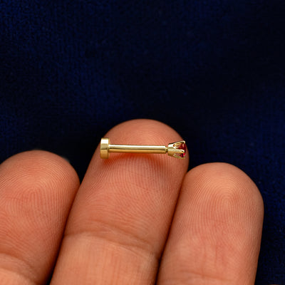 Side view of a solid 14k rose gold 2mm Gemstone Flatback Piercing 